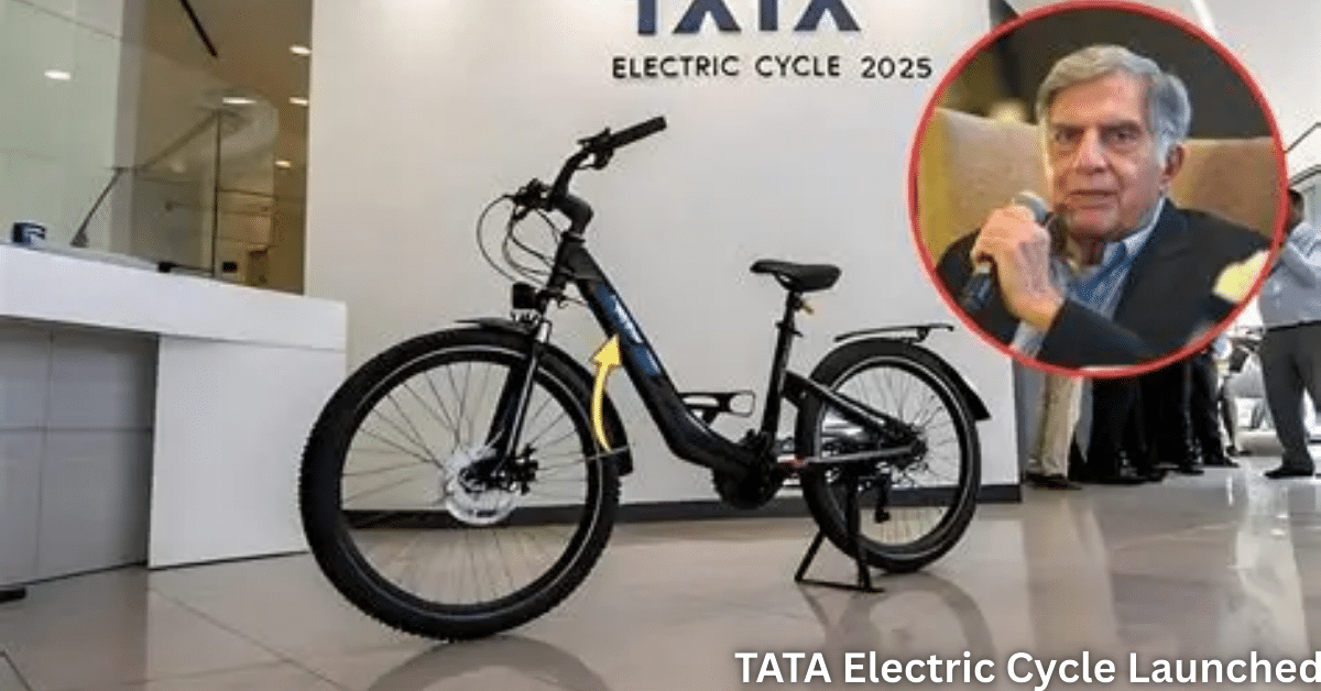 TATA Electric Cycle 2025 launch mockup showing black e-bike display with yellow accents beside Ratan Tata portrait and showroom branding - viral hoax debunked.